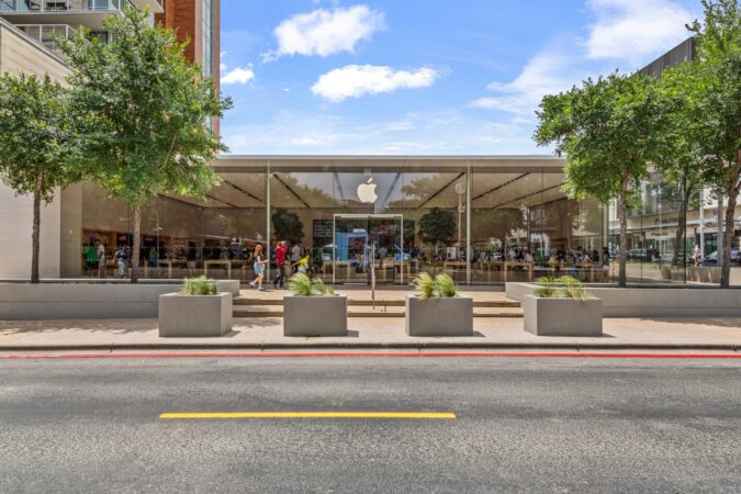 High-end retail storefront with discreetly integrated protective infrastructure.