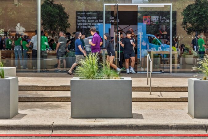 High-end retail storefront with discreetly integrated protective infrastructure.
